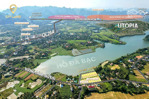 đất mặt hồ đá bạc 120ha , đối diện khu nghĩ dưỡng utopia , dân cư đông đúc.