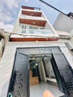 nhà 4 tầng mới 100%, hẻm xe hơi 5m, gần lê văn việt.