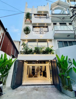 nhà xây mới 5 tầng 50m2 hẻm xe hơi ngay chợ rau củ lê văn thọ.