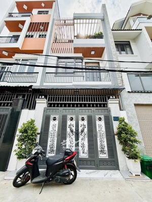 bán căn nhà mới đẹp 2 lầu xe hơi đậu cửa ngay chợ cầu đồng