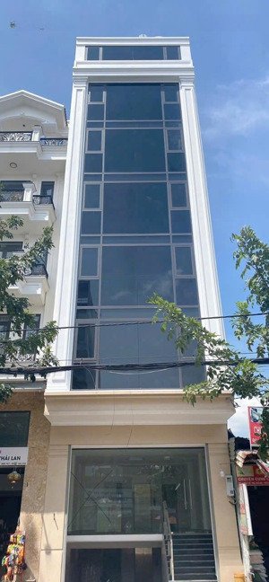 bán toà nhà 6m x 15m. xây 7 lầu có thang máy mặt tiền đường lê thị riêng, phường thới an, q12