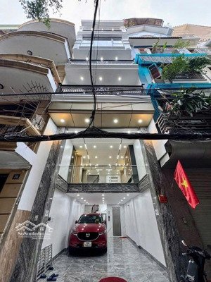 bán nhà phố hoàng cầu 42m2 xây 7 tầng thang máy, mặt ngõ ô tô chánh, cách phố 100m, giá 13,9 tỷ.