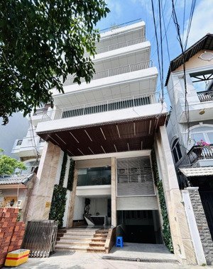 tòa nhà đường nhánh khu trần não 7x25m hầm trệt 4 lầu cho thuê