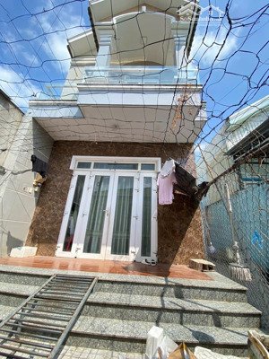 nhà lầu trệt + 2 phòng trọ sát đường đông minh, phường đông hoà, tp dĩ an