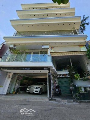 bán tòa nhà 5 tầng kiệt ô tô 5m trung tâm thành phố, phía sau có kiệt 2m có gara ô tô 4 chiếc