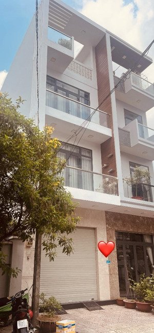 bán nhà quận 7.ngang 4m dài 25m.xây dựng 4 tầng,có gara xe,nhà mới,giá10ty