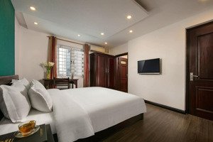 bàn nhà ngõ 34 hoàng cầu,2oto tránh,vỉa hè, 8 tầng thang máy, kd khách sạn 15p, lợi nhuận 800tr/năm