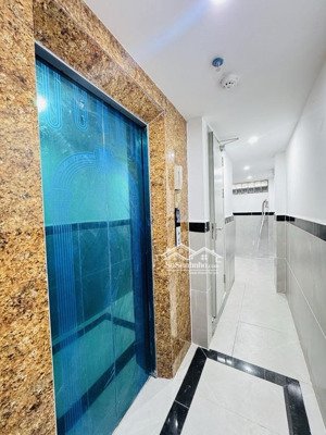 bán nhà dòng tiền 60tr/th 7 tầng 12 phòng mới full đồ - 2 mặt ngõ - 5m ô tô phố hoàng mai.