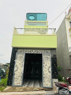 bán nhà gần bệnh viện dĩ an mặt tiền đường thông mỹ phước - tân vạn