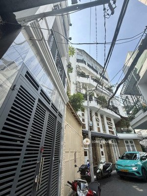 nhà 4 tầng, 5 phòng ngủ, xe hơi tới nhà- 200m ra tới đường phan xích long