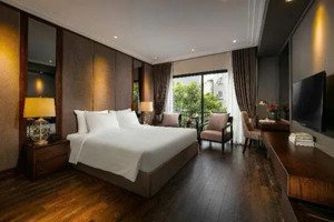 bán tòa nhà đường trần thái tông, 127m2 x 7 tầng, mt: 8.1m