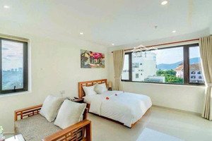 tòa căn hộ - khách sạn lê thước, cách biển 200m dòng tiền ổn định, lh 