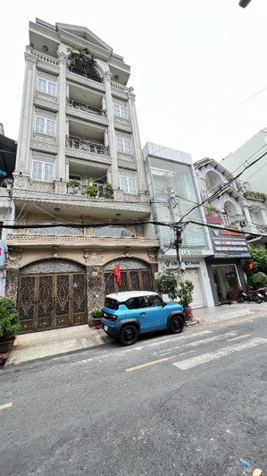 bân toà nhà mt phạm văn bạch tân bình- ngay sân bay - nhà ga metro tham lương dt 10x30 - giá 38tỷ