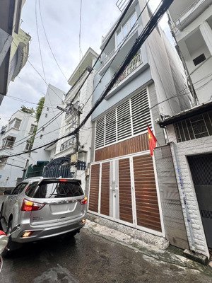 bán đi định cư - nhà đẹp 4tầng (5 x 14) hẻm oto thông, cách mặt tiền huỳnh văn bánh chỉ 40m