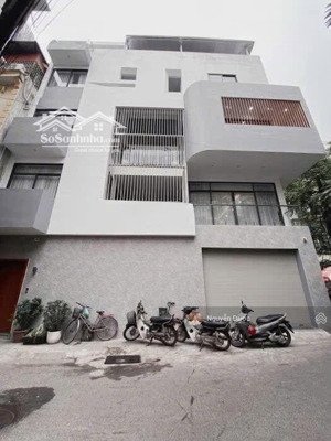 bán nhà phố hoàng cầu, đống đa, dt 100m, mt 12m, lô góc, 5 tầng, thang máy, sổ vuông, oto dừng đỗ