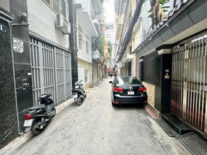 thái thịnh phân lô ô tô, 2 mặt ngõ kinh doanh dt 50m x 6 tầng thang máy giá 14,8 tỷ.