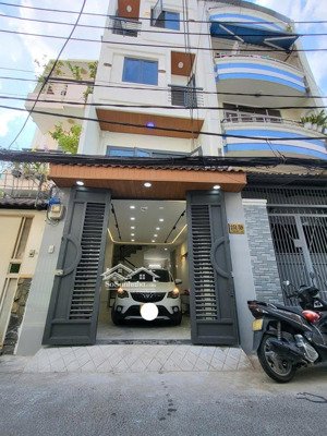 bán gấp nhà hẻm xe hơi 7 chỗ nằm trong nhà. đường lê quang định. dt: 4.5x12m. xây 5 tầng thang máy.