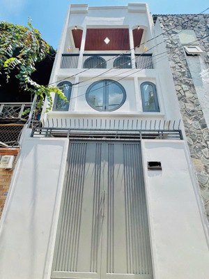 bán nhà mới 4 tầng lê quang định 3pn, sân thượng, cách mt 40m giá chỉ 1,6 tỷ tl