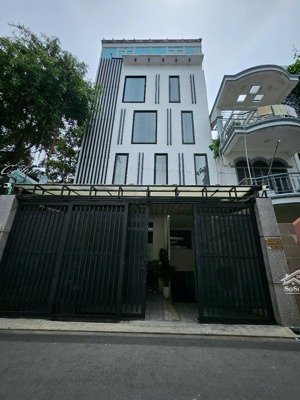 cho thuê tòa nhà mặt tiền 23 phổ quang, tân bình, 8x20m - hầm - 4 lầu