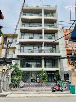 bán gấp ! tòa nhà góc 2 mặt tiền hà huy giáp - dt: 19 x 29m - 7 tầng - hđt: 230 tr. giá chỉ 55 tỷ