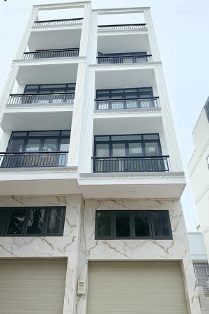 g.iảm 2 tỷ - nhà xây mới- toà nhà mặt tiền đường kinh doanh - ngay lê quang định gần phạm văn đồng