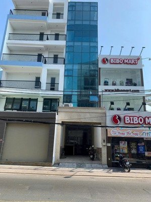 tòa nhà ốp kính có thang máy mặt tiền 283a lê quang định - bình thạnh