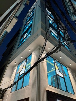 bán nhà số 7 ngõ 12/85 đào tấn, nhà xây mới 7 tầng căn góc có thang máy, ngõ rộng ô tô 7 chỗ đỗ cửa