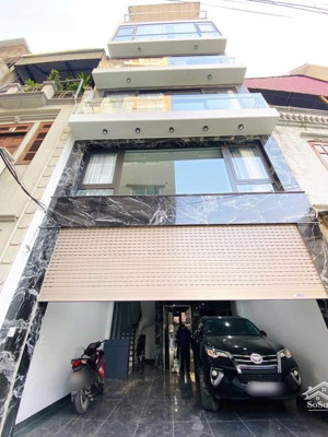 bán nhà phân lô giảng võ,hào nam,mặt ngõ ô tô vào,7 tầng thang máy ,ngõ thông, gần phố-21.9 tỷ