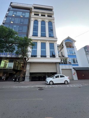 toà building trung kính dt 105m2 x 9t mt 7m thông sàn, thang máy, vỉa hè rộng, mặt phố, dt 200tr/th