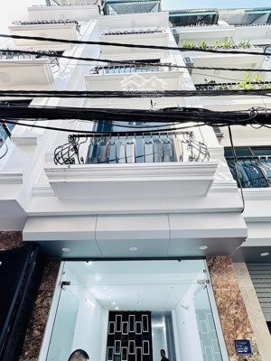 ô tô vào nhà - ngõ thông kinh doanh - có thang máy - thoáng trước sau - dt rộng - 7 phòng cho thuê