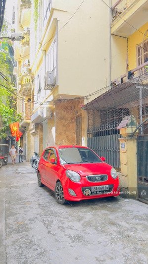 phố hào nam, mặt ngõ, nhà xây mới, oto đỗ cửa, 52m2 * 7 tầng thang máy, làm văn phòng/ở/cho thuê.