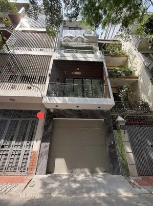 bán nhà phân lô hoàng cầu đống đa, 70m2 x 5 tầng thang máy mt 4m, gara ô tô, vỉa hè, 2 thoáng