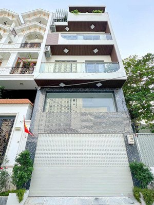 nhà 5.5x13m, 5tầng, có thang máy, 2 ôtô đậu trong nhà, giá 13tỷ5. mt huỳnh tấn phát, phú thuận, q7