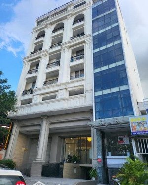 bán nhà mặt phố ngọc khánh, dt 120m2 x 9 tầng, mặt tiền 9m, lô góc, thuê 200 tr/ th, giá 80 tỷ.