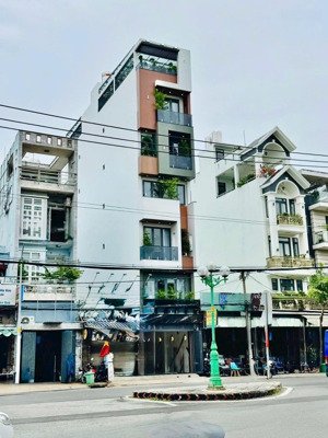 nhà mới 4 tầng mặt tiền 12m có thang máy 650kg đường tân sơn p12 gò vấp. dt: 4x25m, giá: 19.8tỷ tl