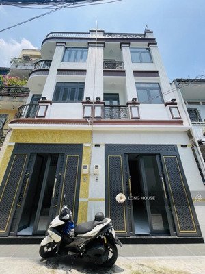 nhà 4 tầng, 50m2, xây mới- oto vào nhà, sau căn mặt tiền ngay lê quang định- nơ trang long