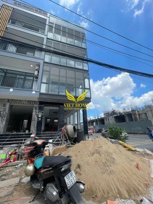 cho thuê tòa vp góc 2 mt vành đai tây - lương định của, 5x20m, giá 100tr/tháng, hầm, 5 tầng, 5wc