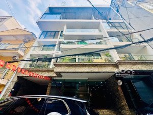 [mt =16m] building lạc long quân _ 300m _8 tầng_ mt 16m _ 135ty_ 3 ôtô tránh _ 7 nổi + 1hầm