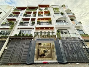 nhà đường thông, sát bên c. viên, dt: 4x14m, lửng, 3lầu, 4pn, 6vs, sân thượng, gara ôtô, 6,5 tỷ