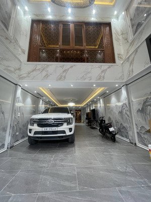siêu phẩm nguyễn văn linh 100m2 7 tầng thang máy gara ô tô đường ô tô tránh chỉ 25.6 tỷ