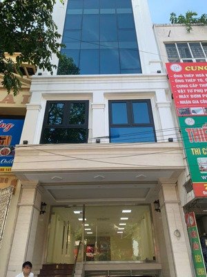 toà nhà mặt phố trương công giai 100m2x7t thang máyxmt 6m - 63 tỷ - có hẩm, vỉa hè rộng, kinh doanh