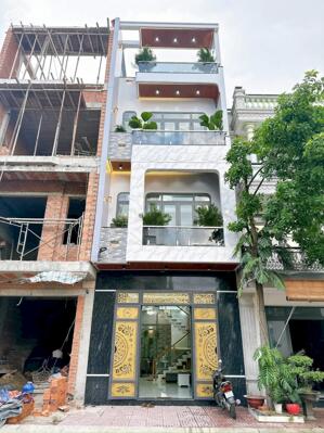 BÁN NHÀ DĨ AN GẦN NGÃ TƯ 550- 2 LẦU FULL NỘI THẤT