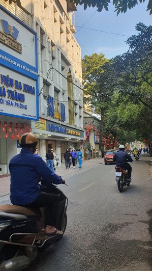 mặt phố tt đống đa - tòa vp 7 tầng thang máy - 1 mặt phố, 1 mặt ngõ ô tô tránh - dòng tiền 110 tr/t