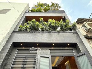 nhà xây mới 3 lầu 32m2 hẻm xe hơi đường lê văn thọ, ngay công viên làng hoa.