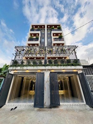 nhà đường thông hà huy giáp, dt:4x22m, lửng, 3lầu, 4pn, sân thượng, ban công, gara ôtô, p.xông hơi.