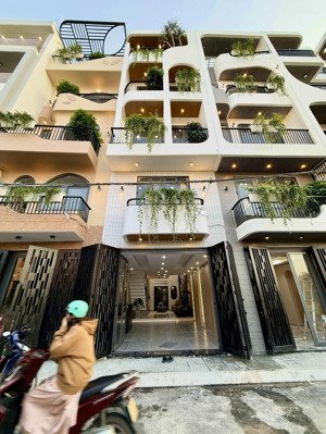 nhà có ô chờ thang máy, đường thông tx 25, dt:4x16m, lửng, 3 lầu, 4pn, sân thượng, gara ôtô.