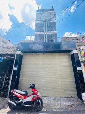 bán nhà 6 tầng có thang máy ngay mặt tiền nơ trang long, 99m2, giá bán 18 tỷ tl