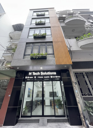 cam kết nhà thật 100%.phân lô hoàng cầu 65m2 oto đỗ trong nhà,kd văn phòng,cạnh quận uỷ giá 29,5tỷ