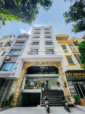 cho thuê nhà mp nguyễn khang - cầu giấy. 100m2 x 7 tầng 1 hầm, mt: 9m. thông sàn, thang máy, đh, nl