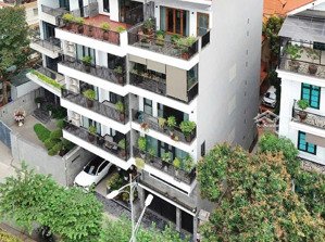 tòa nhà mặt phố, dt sổ 125m2, mt 8m, vị trí kim cương tây hồ, dòng tiền 1.5 tỷ/năm